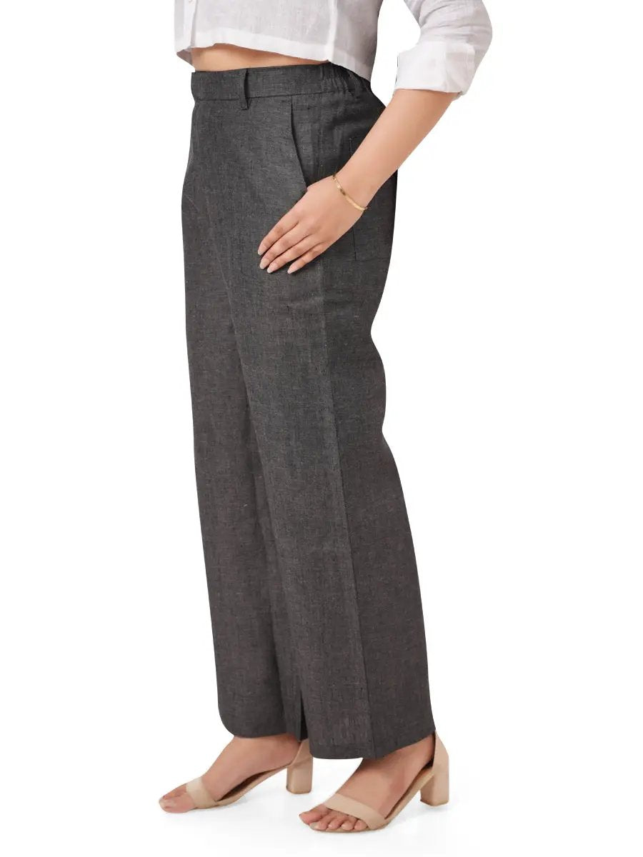 women wearing charcoal black linen pants on a white background