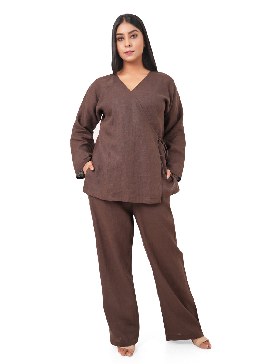 Woman wearing a chocolate brown linen co-ord set on a white background