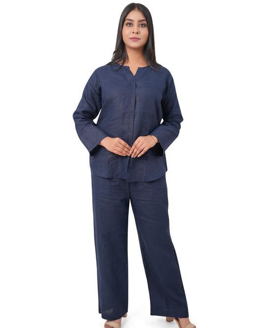 Woman wearing a navy blue pure linen co-ord set on a white background