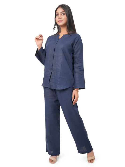 Woman wearing a navy blue pure linen co-ord set on a white background