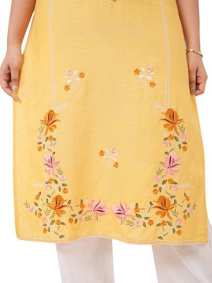 yellow linen kurti with floral embroidery on a white background